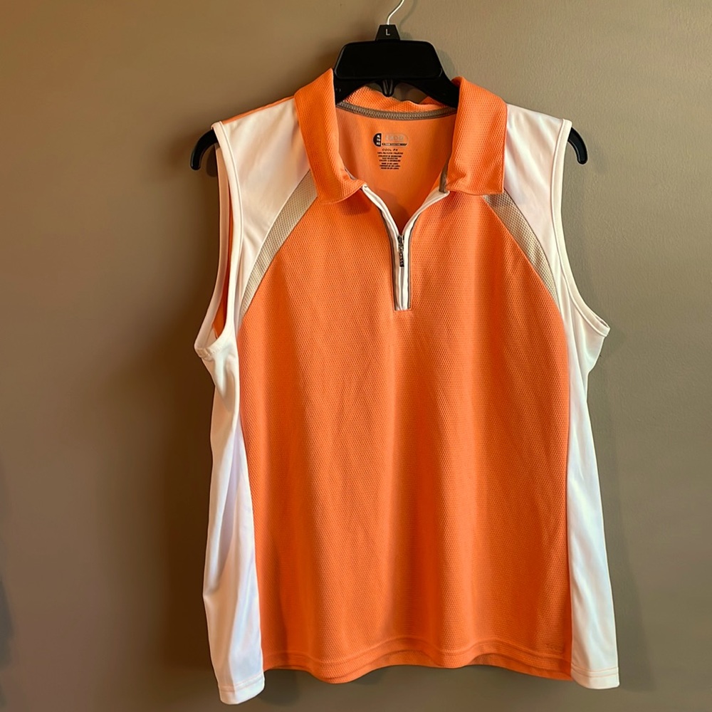 Ladies Izod sleeveless golf shirt. Tennessee Orange.